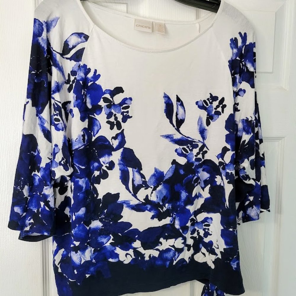 Pretty Chico's tunic with blue flowers and side tie. Size 2